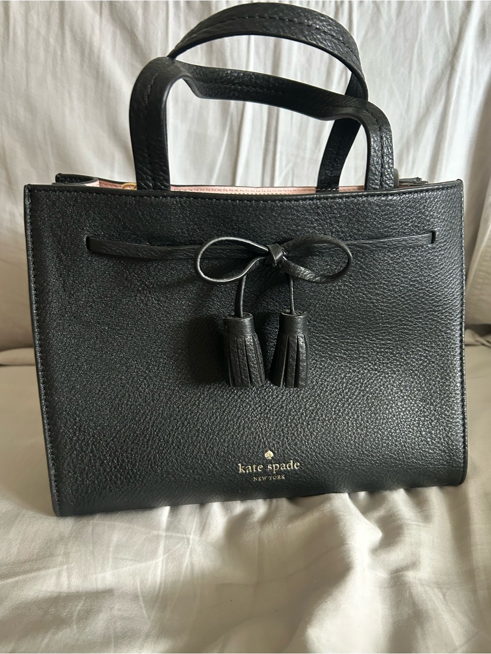 Kate Spade Black pebbled leather satchel with tassel bow detail
